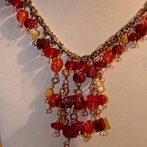 Artisan made red and orange beaded necklace. Boho